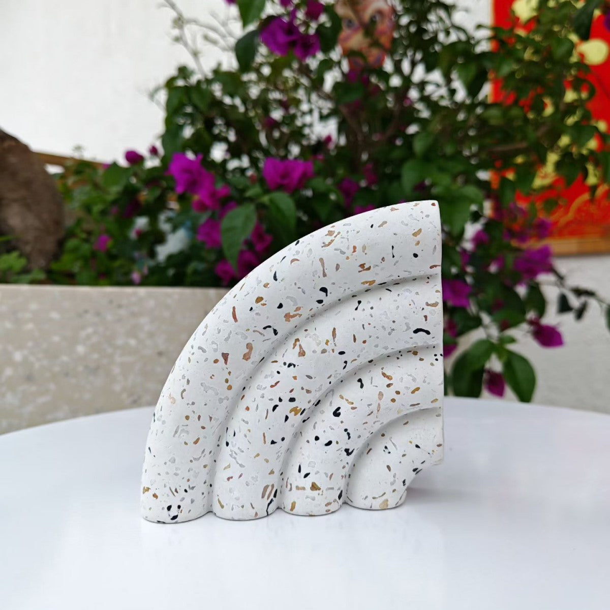Terrazzo-patterned fan-shaped bookshelf